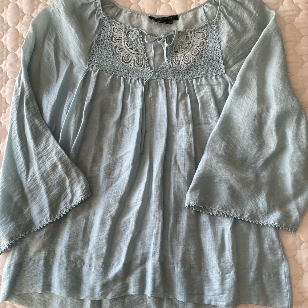 Sea Blue blouse with nice details on the neck